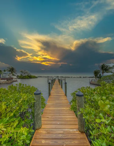 a view of a lake with a big house