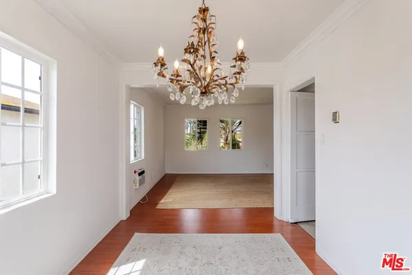 an entryway with a chandelier