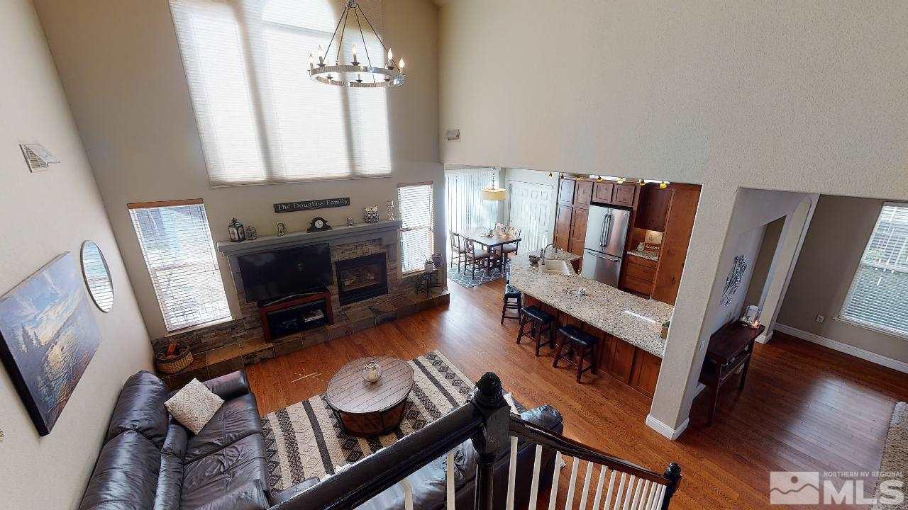 9565 Apache Rose Drive Reno, NV 89521 - Photo 16 of 25 a living room with furniture fireplace and flat screen tv