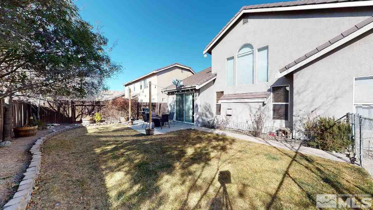9565 Apache Rose Drive Reno, NV 89521 - Photo 23 of 25 a view of a house with a patio