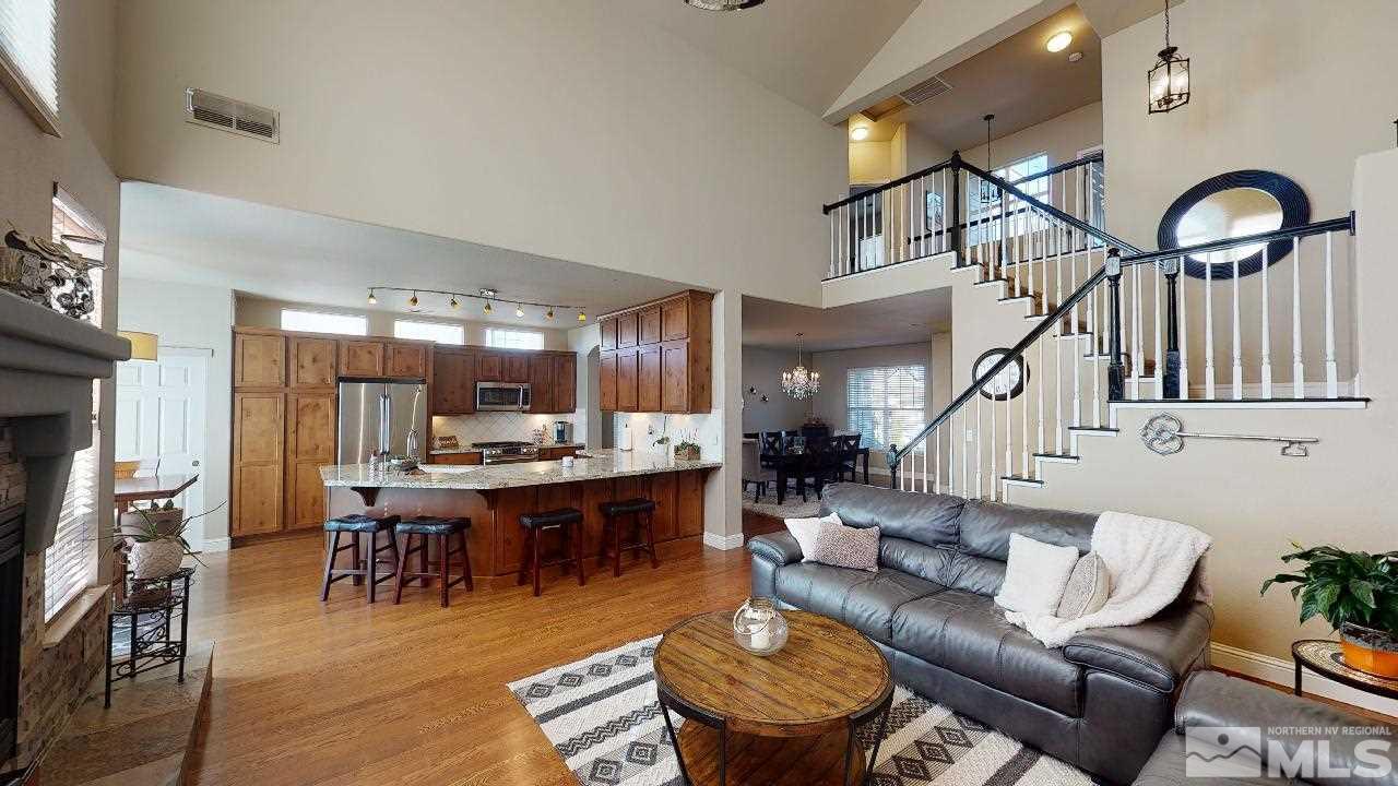 9565 Apache Rose Drive Reno, NV 89521 - Photo 3 of 25 a living room with furniture and a fireplace