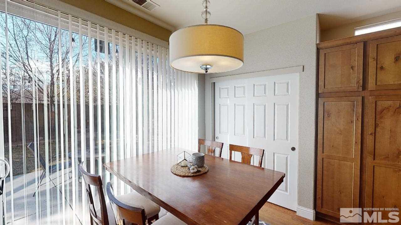 9565 Apache Rose Drive Reno, NV 89521 - Photo 9 of 25 a view of a dining room with furniture and a window