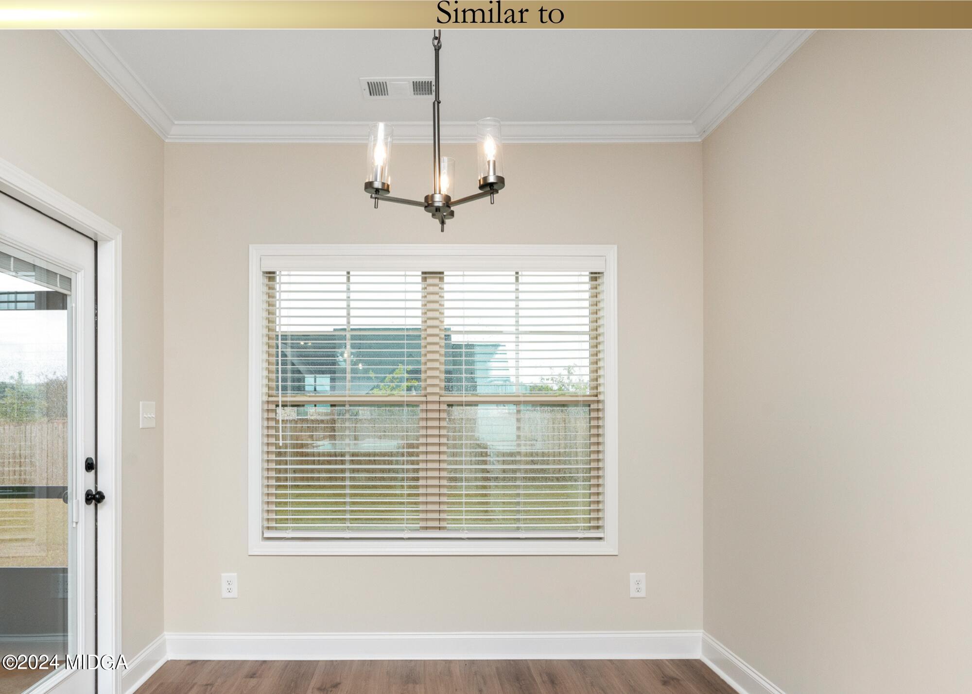 222 Overton Drive Perry, GA 31069 - Photo 11 of 18 a view of an empty room with a window