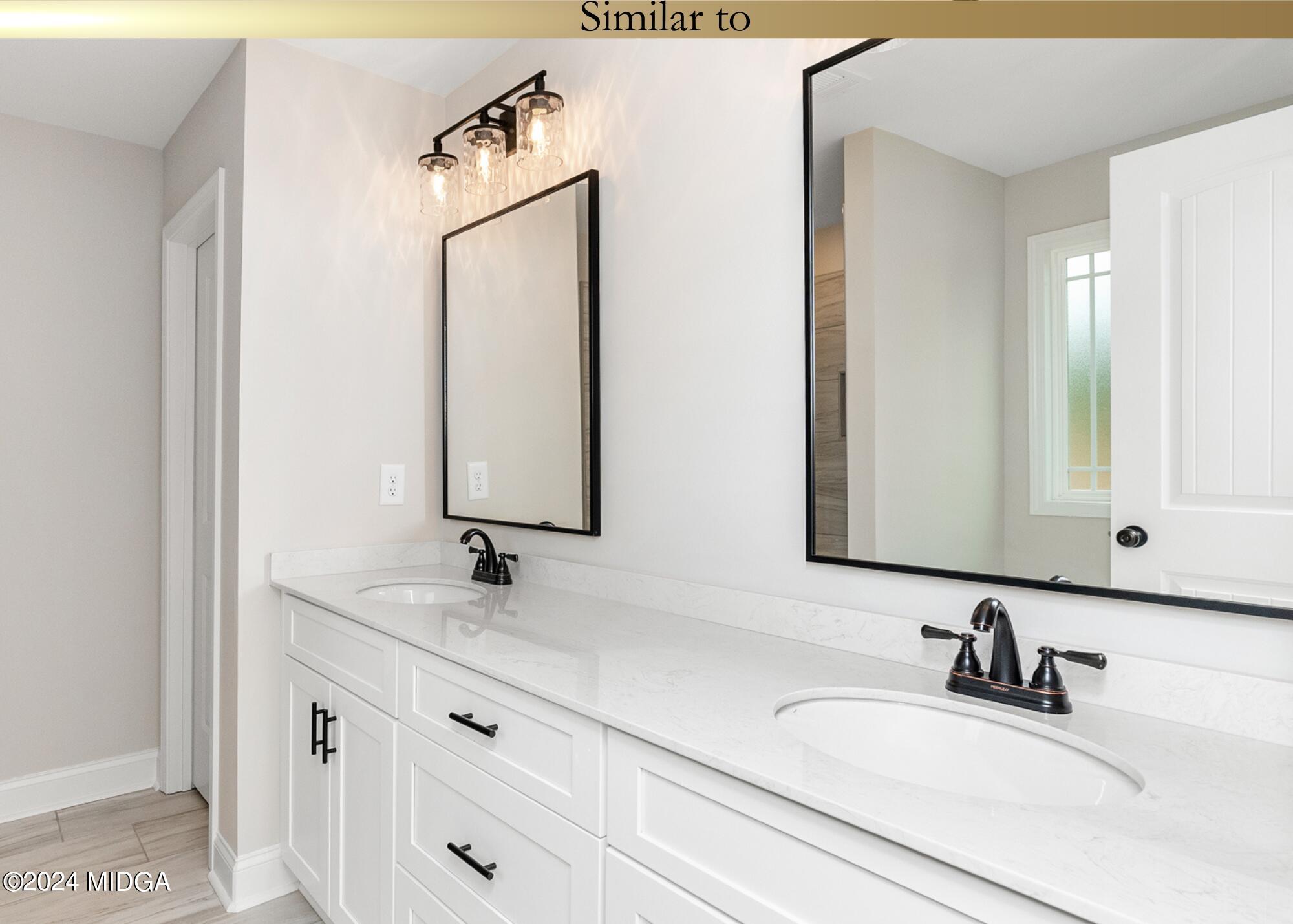 222 Overton Drive Perry, GA 31069 - Photo 13 of 18 a bathroom with a sink and a mirror