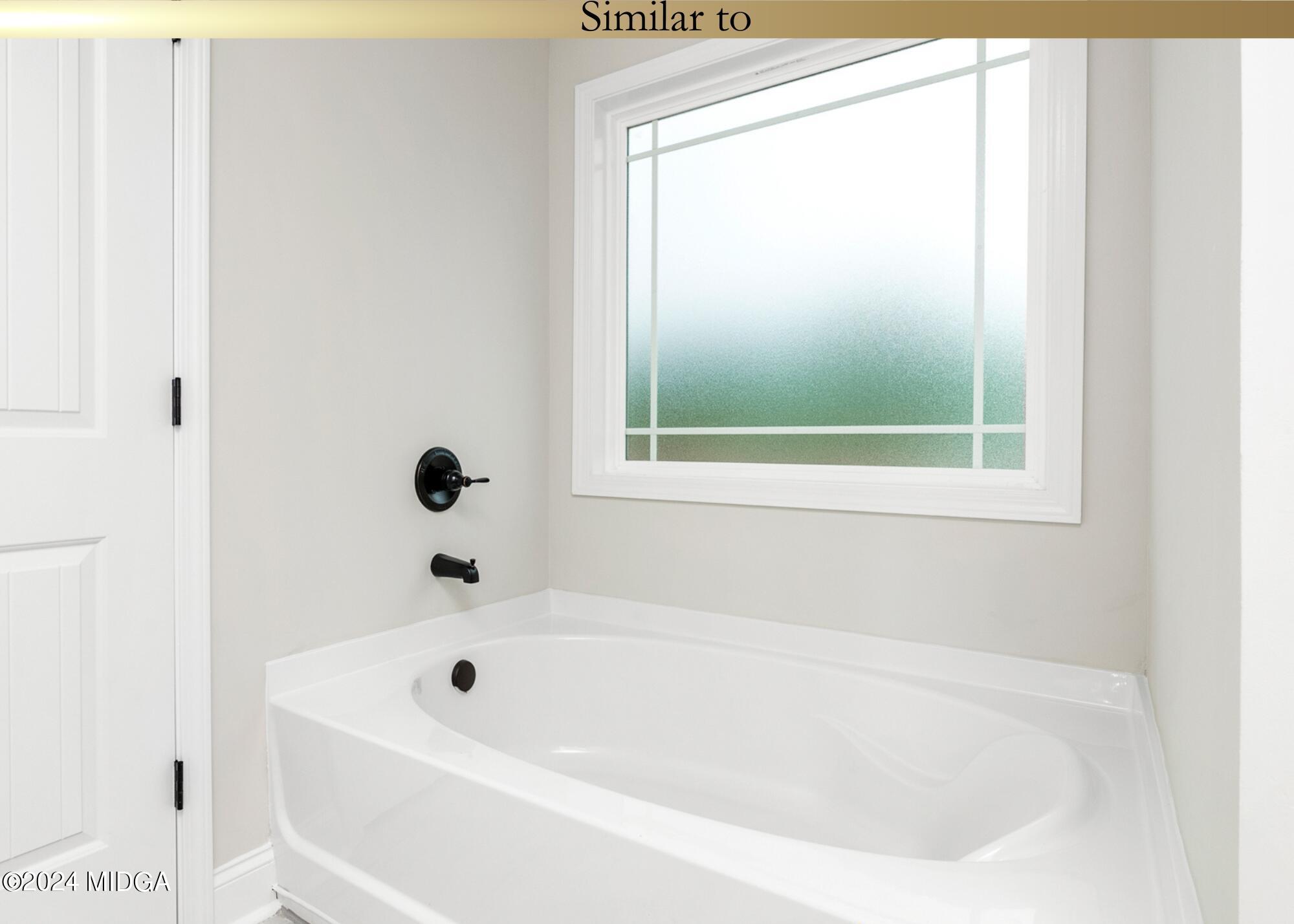 222 Overton Drive Perry, GA 31069 - Photo 15 of 18 a white bath tub sitting next to a window