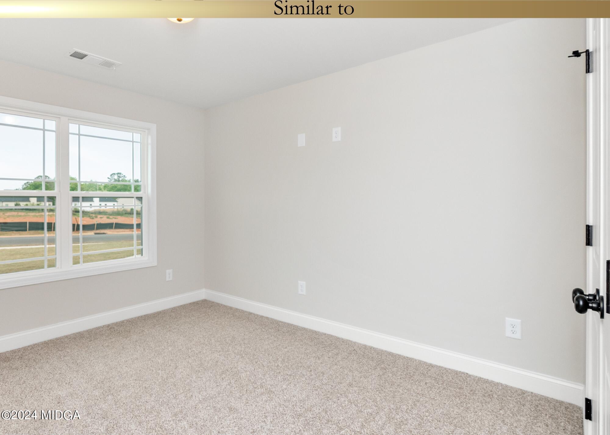 222 Overton Drive Perry, GA 31069 - Photo 16 of 18 an empty room with a window