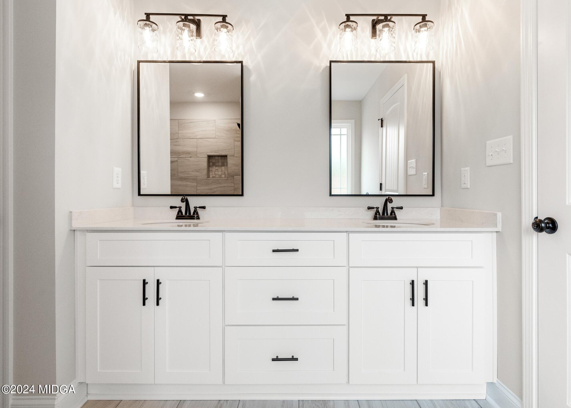 222 Overton Drive Perry, GA 31069 - Photo 17 of 18 a bathroom with double vanity sink and a mirror