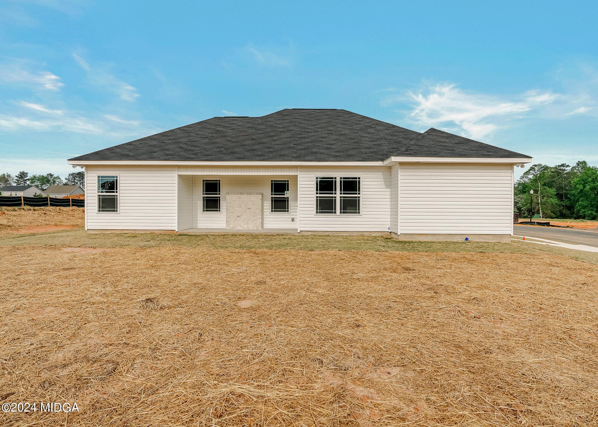 222 Overton Drive Perry, GA 31069 - Photo 18 of 18 a yard that is sitting in front of a house