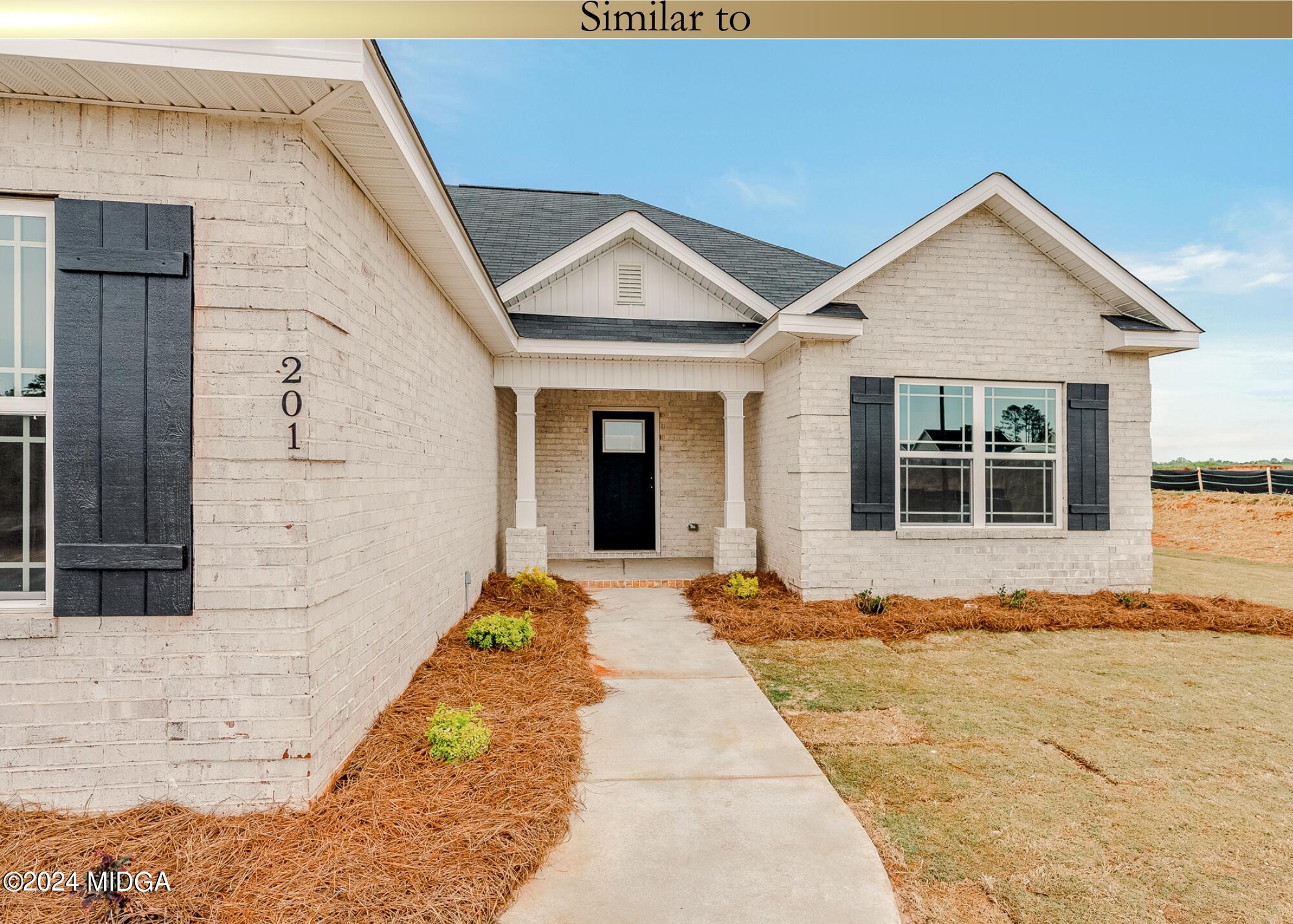 222 Overton Drive Perry, GA 31069 - Photo 3 of 18 a front view of a house with a yard