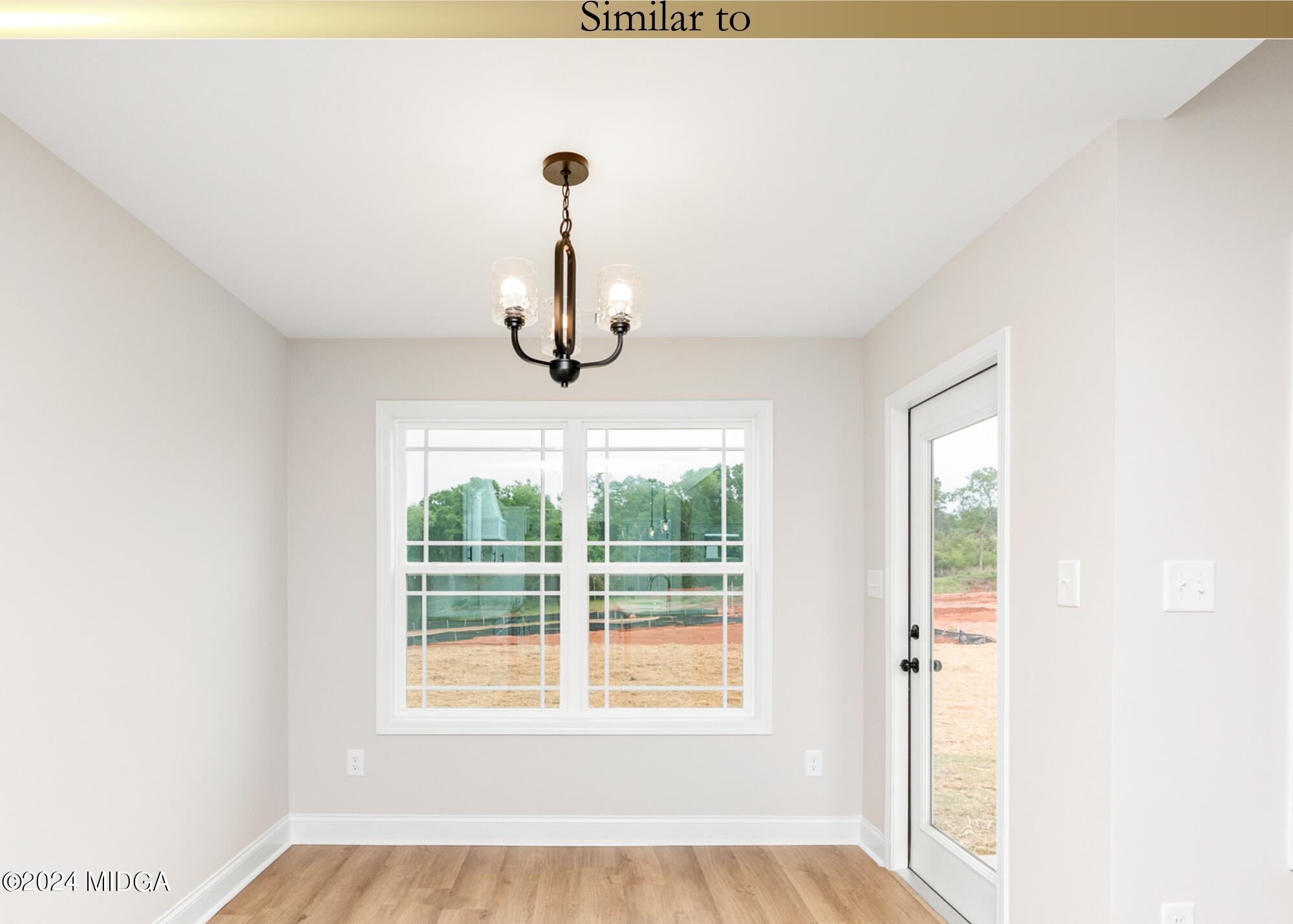 222 Overton Drive Perry, GA 31069 - Photo 9 of 18 a view of a livingroom with a chandelier