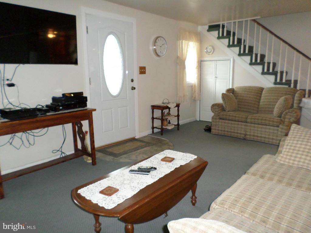 2824 Patapsco Road Finksburg, MD 21048 - Photo 3 of 29 a living room with furniture and a flat screen tv