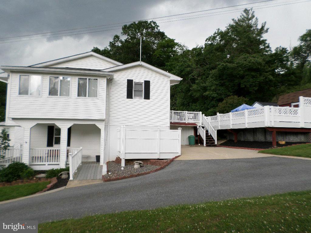 2824 Patapsco Road Finksburg, MD 21048 - Photo 22 of 29 a view of a white house with a yard and garage