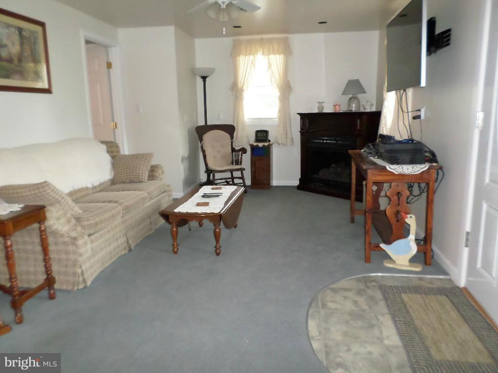 2824 Patapsco Road Finksburg, MD 21048 - Photo 4 of 29 a living room with furniture and a fireplace