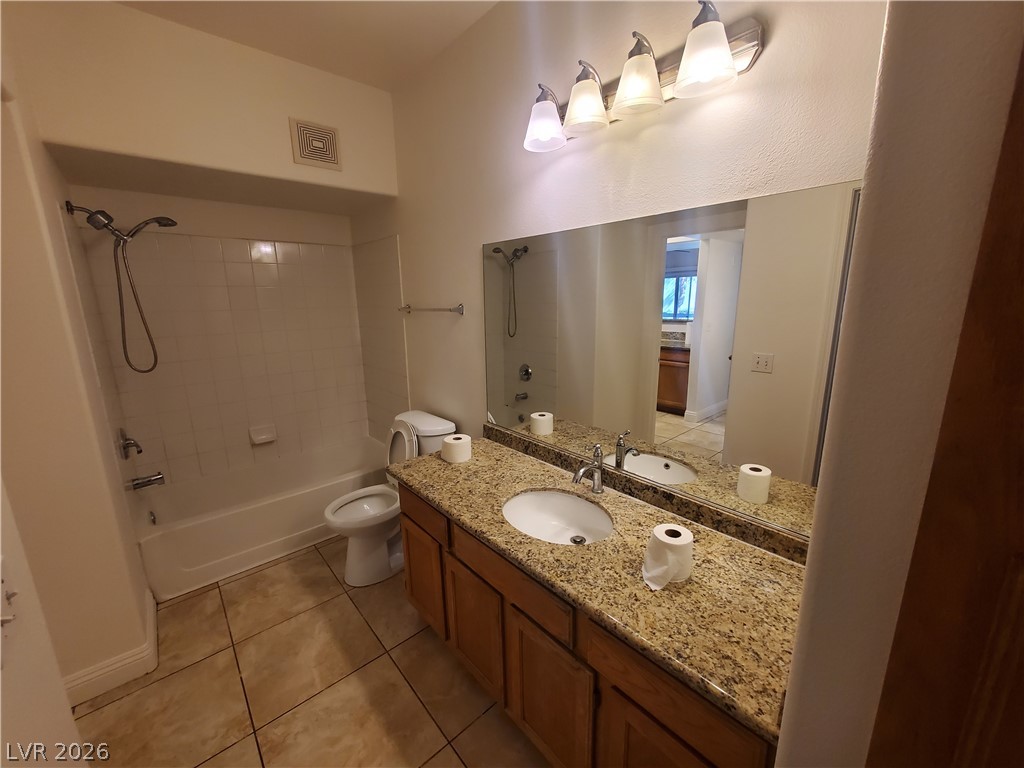 7255 West Sunset Road, Unit 1167 Las Vegas, NV 89113 - Photo 11 of 15 Full bathroom with vanity, shower / bathtub combination, and light tile patterned flooring