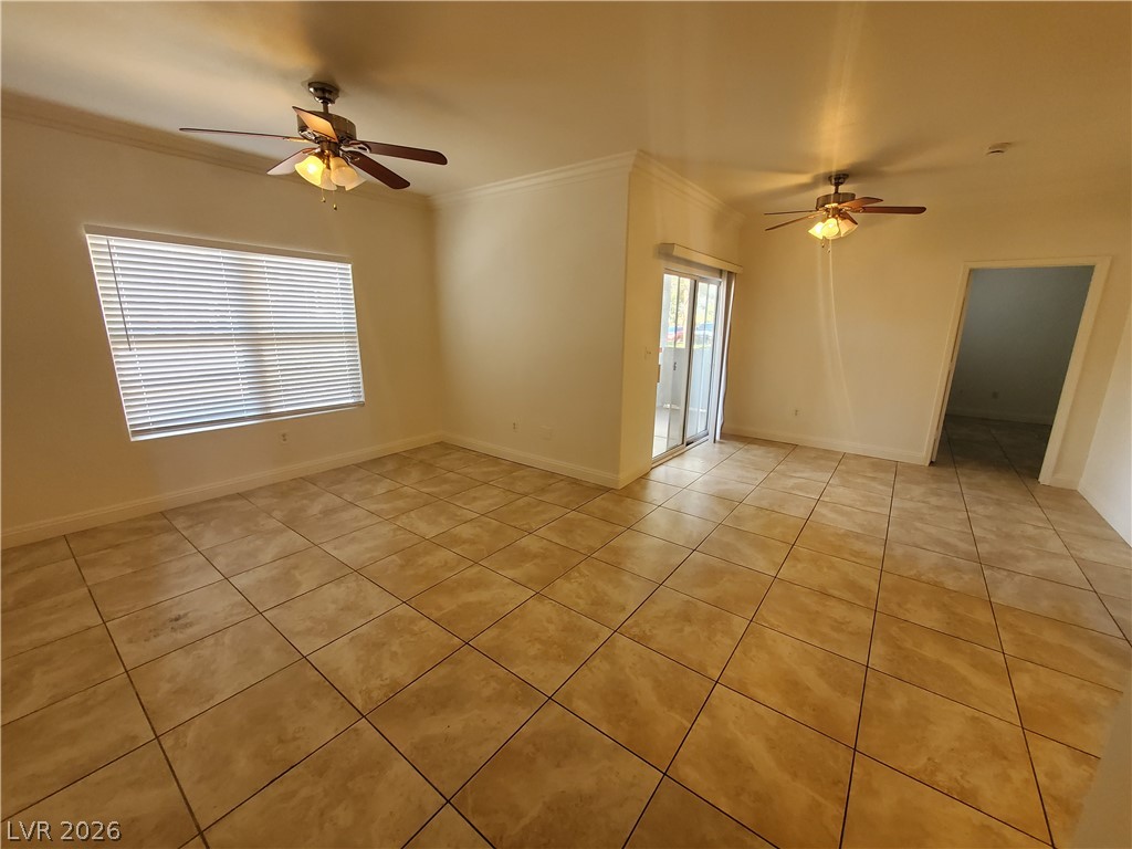 7255 West Sunset Road, Unit 1167 Las Vegas, NV 89113 - Photo 14 of 15 Unfurnished room featuring ceiling fan, light tile patterned floors, and ornamental molding