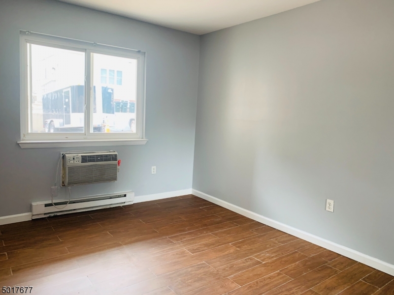 95 Park Street, Unit 3 Montclair, NJ 07042 - Photo 5 of 10 an empty room with a empty space and windows
