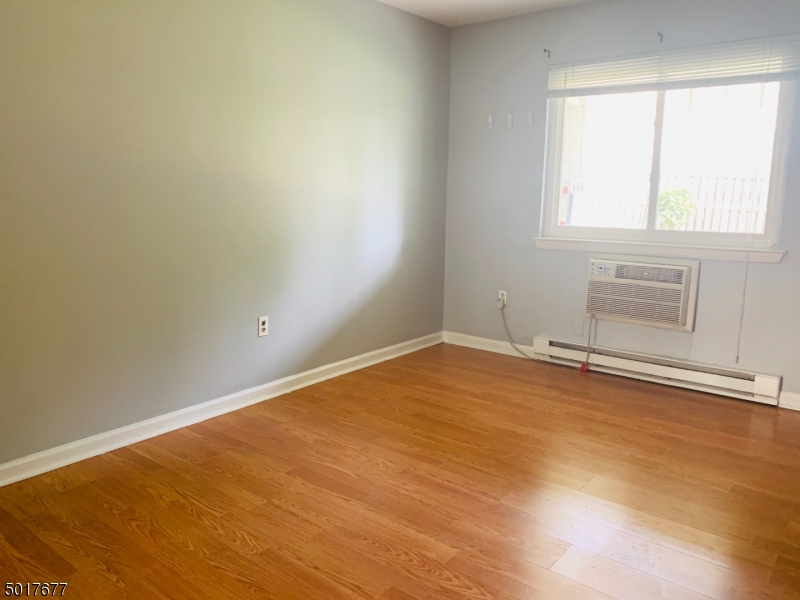 95 Park Street, Unit 3 Montclair, NJ 07042 - Photo 6 of 10 an empty room with a fireplace