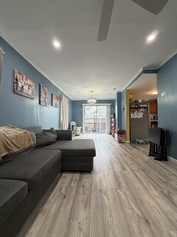 16 Linden Street Lynn, MA 01905 - Photo 11 of 23 a living room with furniture and a wooden floor