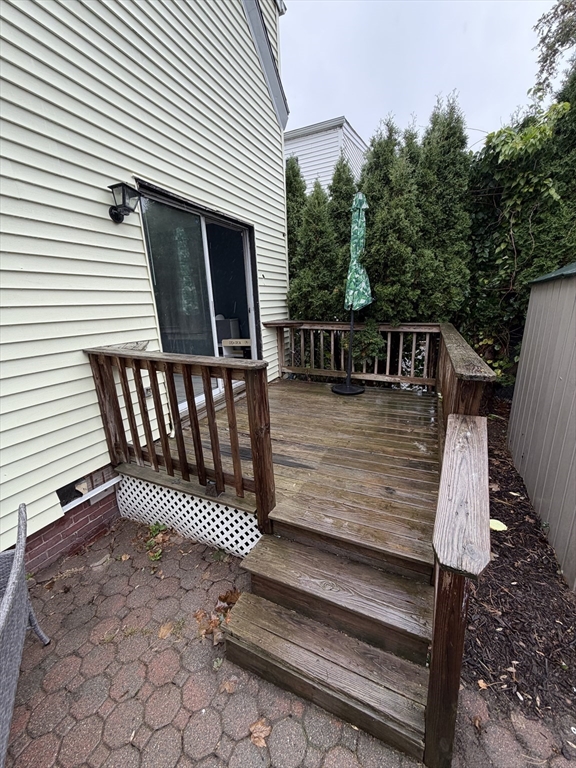16 Linden Street Lynn, MA 01905 - Photo 19 of 23 a view of deck with a chair and floor to ceiling window