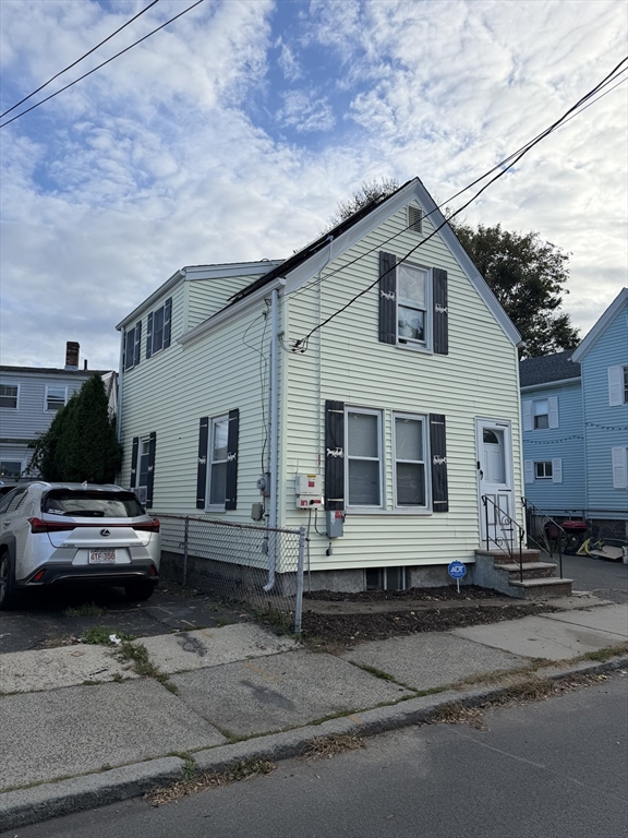 16 Linden Street Lynn, MA 01905 - Photo 3 of 23 a front view of a house with a yard