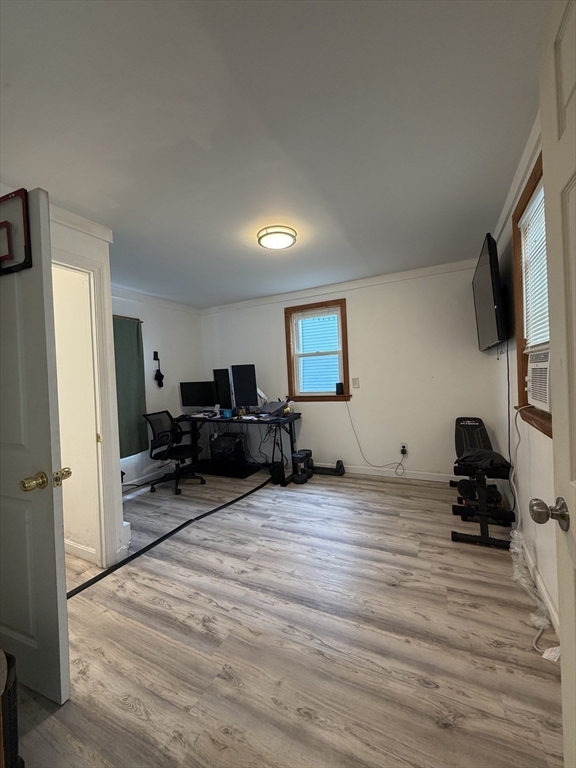 16 Linden Street Lynn, MA 01905 - Photo 8 of 23 a view of a livingroom with furniture and a flat screen tv