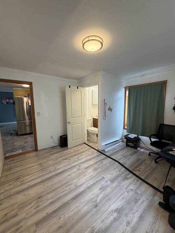 16 Linden Street Lynn, MA 01905 - Photo 10 of 23 a view of a livingroom with wooden floor and a window