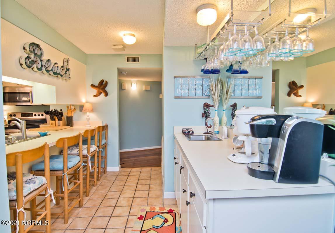 1505 Salter Path Road, Unit 439 Indian Beach, NC 28512 - Photo 13 of 44 Kitchen bar stools & wet bar/coffee bar