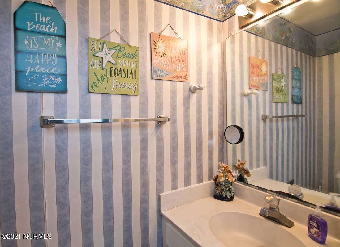 1505 Salter Path Road, Unit 439 Indian Beach, NC 28512 - Photo 24 of 44 Hallway Half Bath