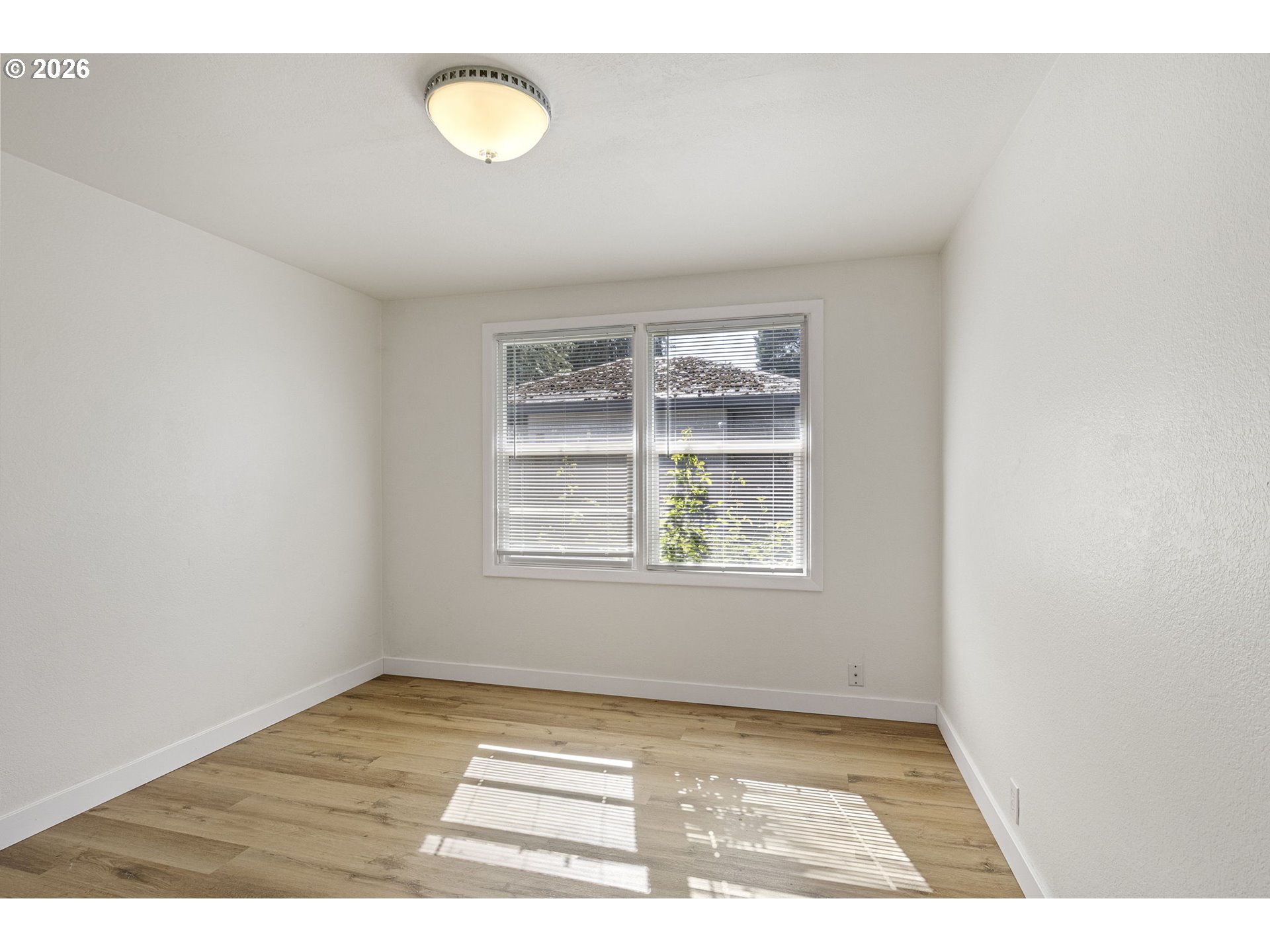 1008 Coburg Road Eugene, OR 97401 - Photo 37 of 46 a view of a room with wooden floor and window
