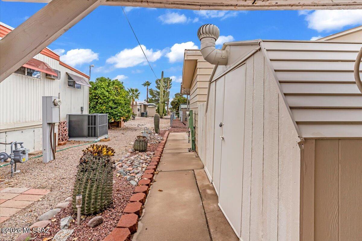5840 West Flying W Street Tucson, AZ 85713 - Photo 36 of 38 a view of a pathway with a potted plants