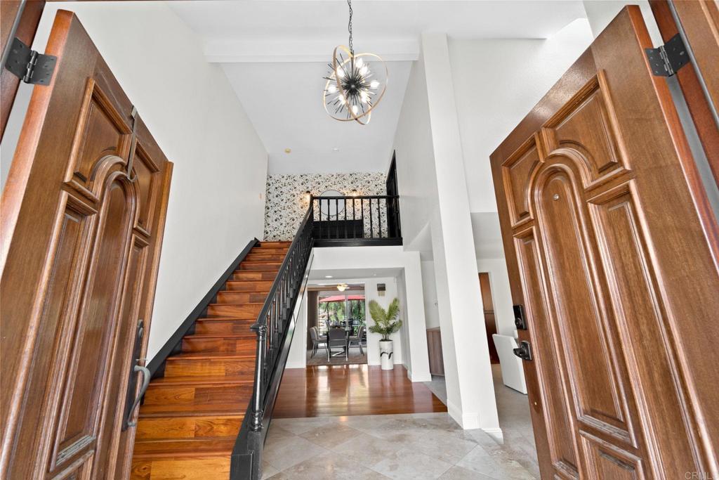 7056 Del Cerro Boulevard San Diego, CA 92120 - Photo 11 of 34 a view of a hallway with wooden floor and entryway