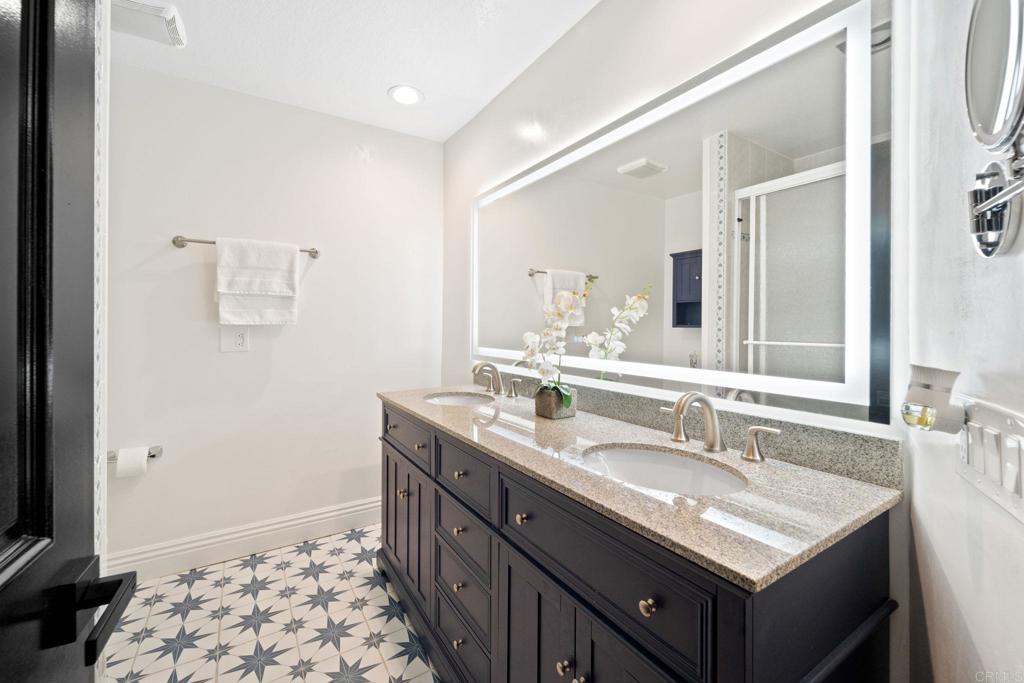 7056 Del Cerro Boulevard San Diego, CA 92120 - Photo 20 of 34 a bathroom with a sink double vanity and a mirror
