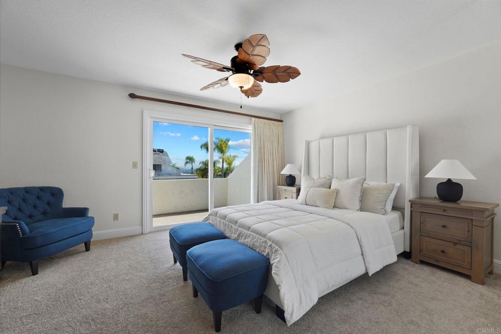 7056 Del Cerro Boulevard San Diego, CA 92120 - Photo 29 of 34 a bedroom with a bed and a chandelier