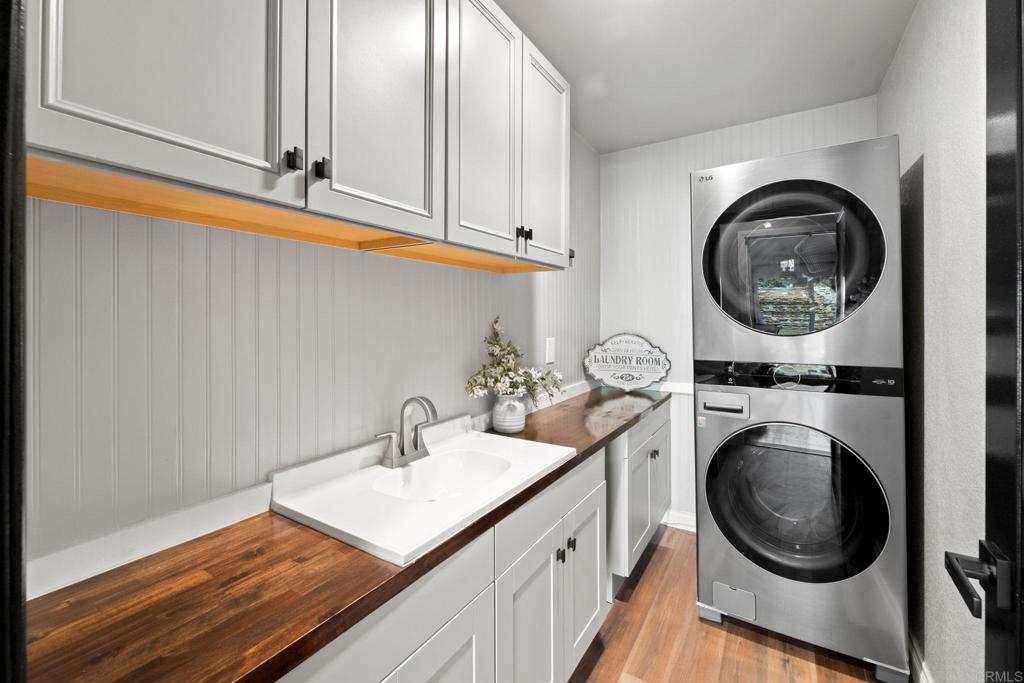 7056 Del Cerro Boulevard San Diego, CA 92120 - Photo 30 of 34 a utility room with sink dryer and washer