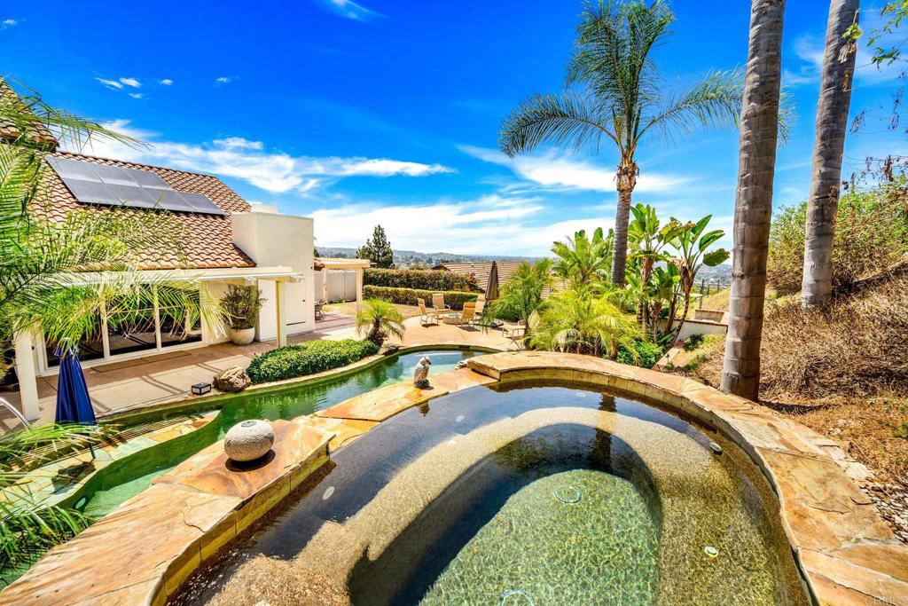 7056 Del Cerro Boulevard San Diego, CA 92120 - Photo 5 of 34 a swimming pool with outdoor seating and yard