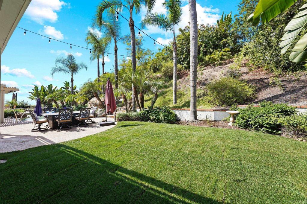 7056 Del Cerro Boulevard San Diego, CA 92120 - Photo 8 of 34 a view of a park with swings and slides