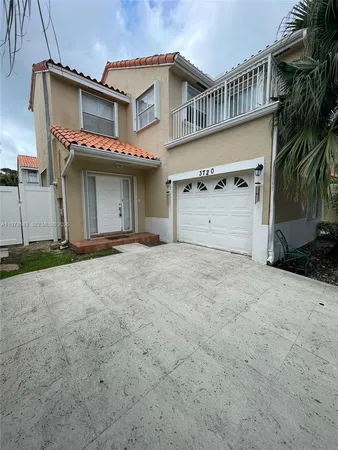 a view of a house with a garage
