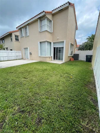 a front view of house with yard and seating area