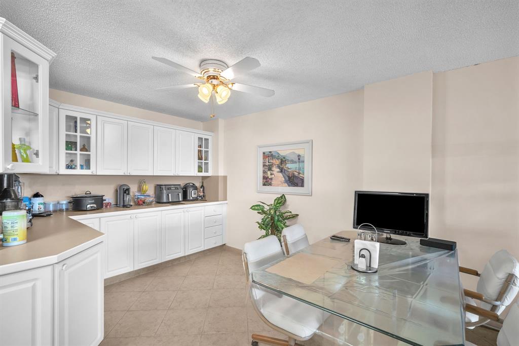 800 Northeast 195th Street, Unit 601 Miami, FL 33179 - Photo 14 of 35 a living room with furniture and a flat screen tv