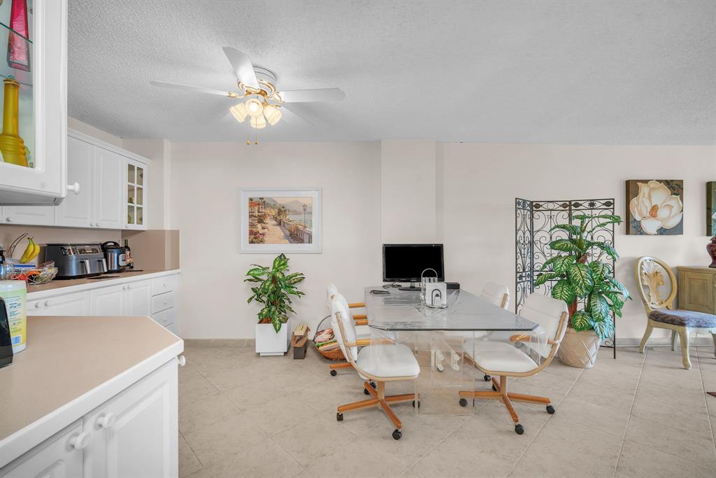 800 Northeast 195th Street, Unit 601 Miami, FL 33179 - Photo 16 of 35 a workspace with a couch and potted plant