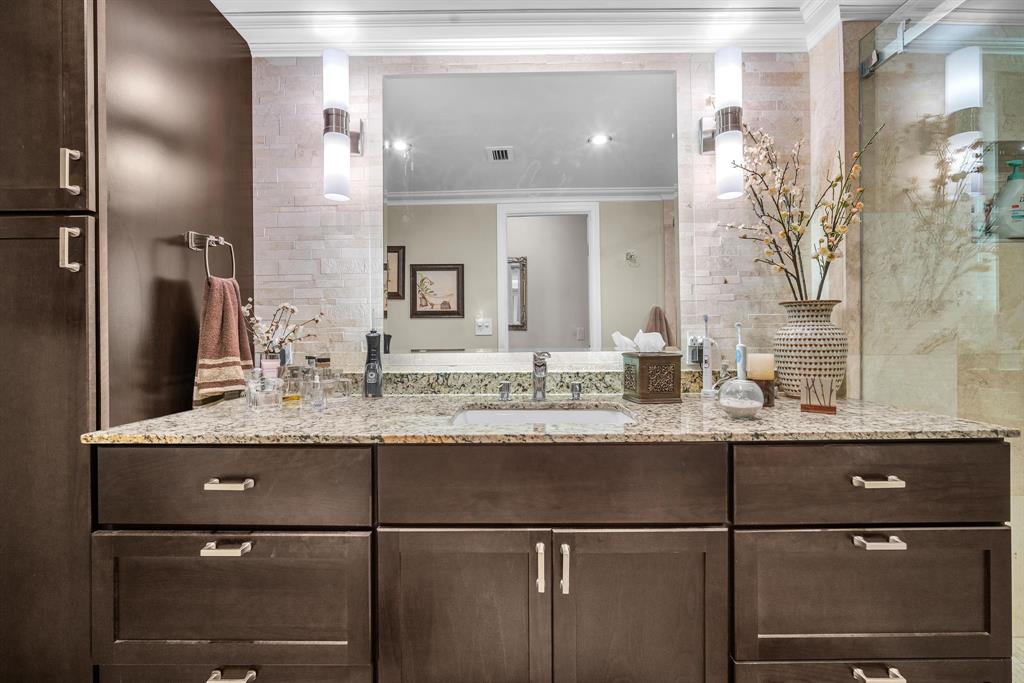 800 Northeast 195th Street, Unit 601 Miami, FL 33179 - Photo 21 of 35 a bathroom with a granite countertop sink a large mirror and vanity
