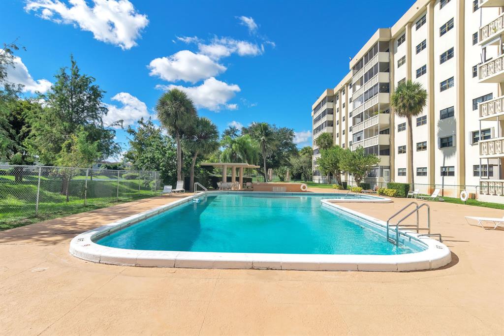 800 Northeast 195th Street, Unit 601 Miami, FL 33179 - Photo 31 of 35 a view of swimming pool with a yard
