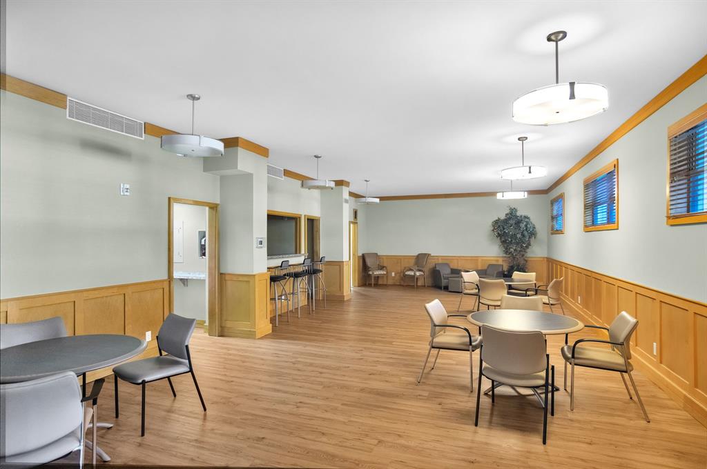 800 Northeast 195th Street, Unit 601 Miami, FL 33179 - Photo 34 of 35 a view of a dining room with furniture and wooden floor