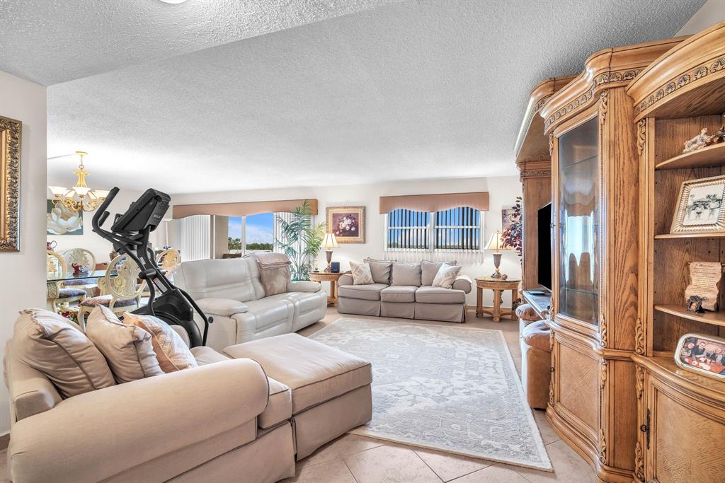 800 Northeast 195th Street, Unit 601 Miami, FL 33179 - Photo 10 of 35 a living room with furniture and a wooden floor