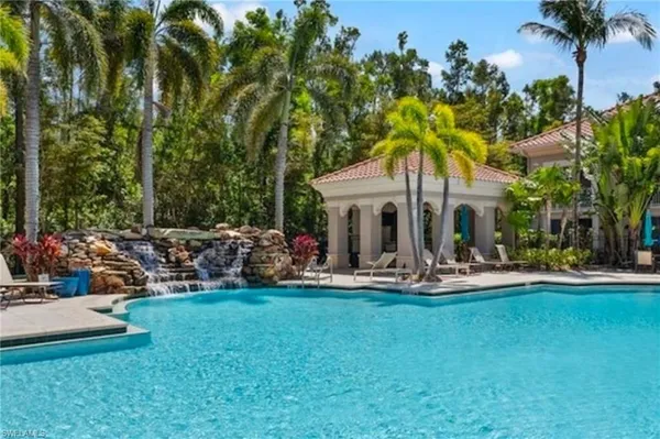 a front view of a house with patio fire pit and outdoor seating