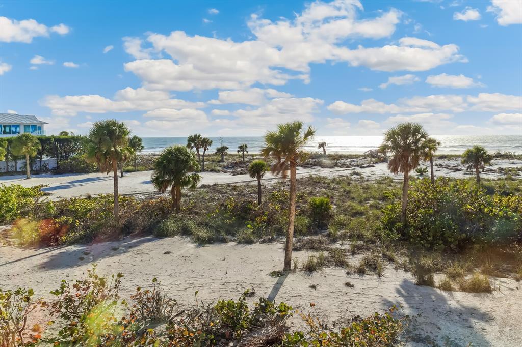 5000 Gasparilla Road, Unit BC203 Boca Grande, FL 33921 - Photo 13 of 34 a view of a yard with a tree