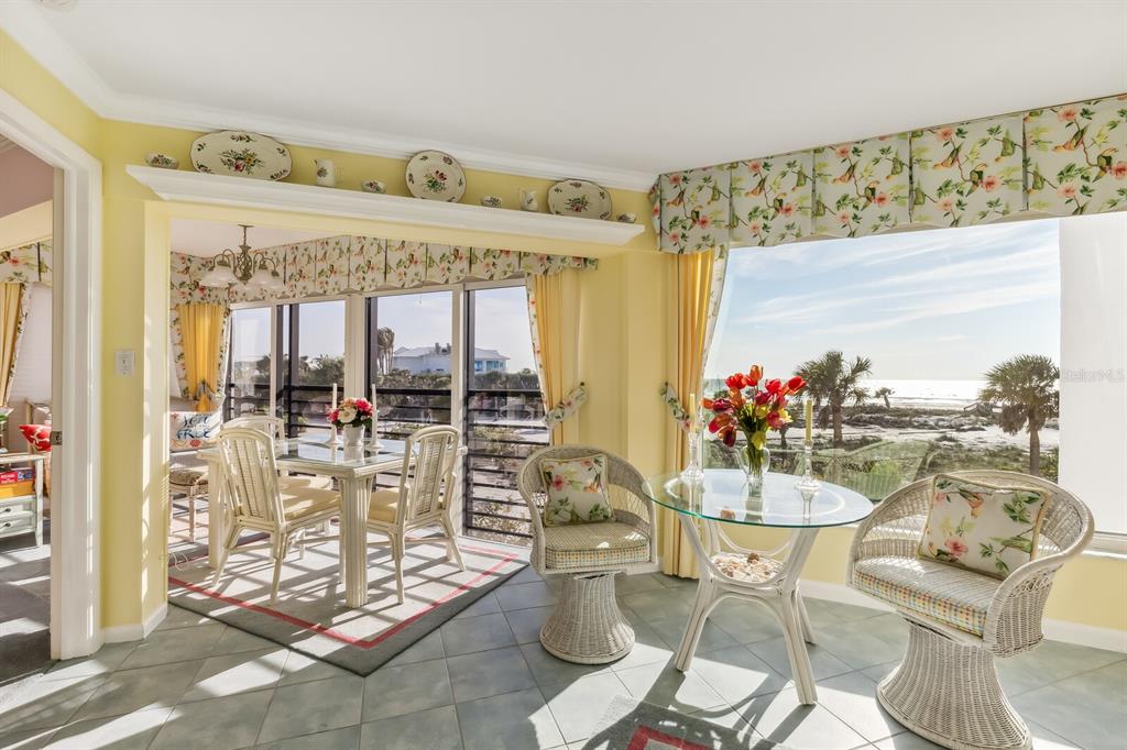 5000 Gasparilla Road, Unit BC203 Boca Grande, FL 33921 - Photo 7 of 34 a view of a dining room with furniture one side kitchen view