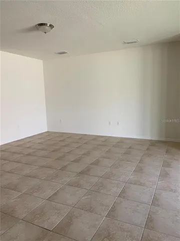 a view of a room with an empty space