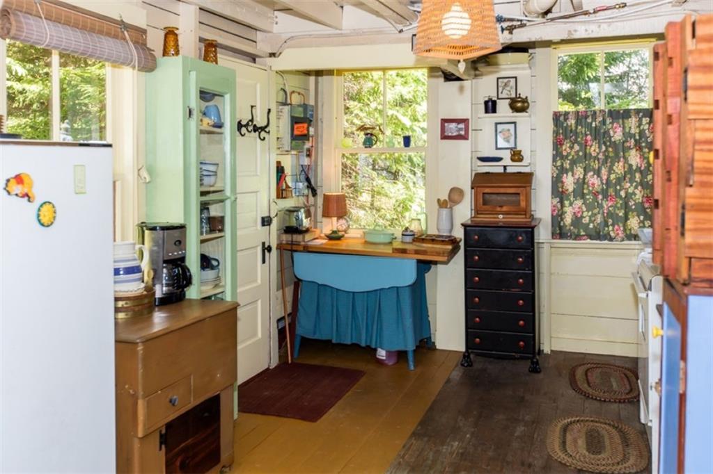 Kitchen open to dining room, with...