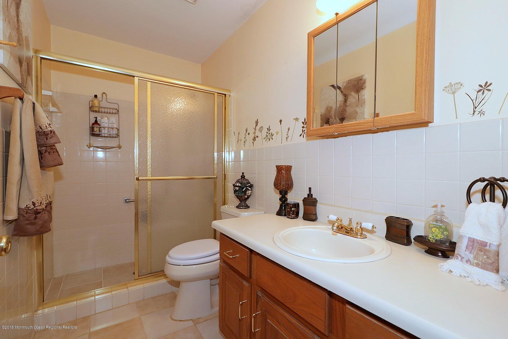 34 B Mill Road Whiting, NJ 08759 - Photo 13 of 22 a bathroom with a sink toilet and shower